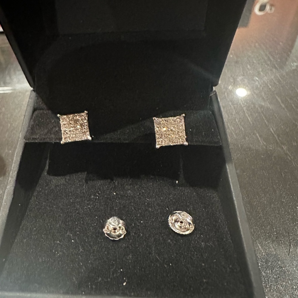 White gold diamond multistory princess cut earrings with screw back.